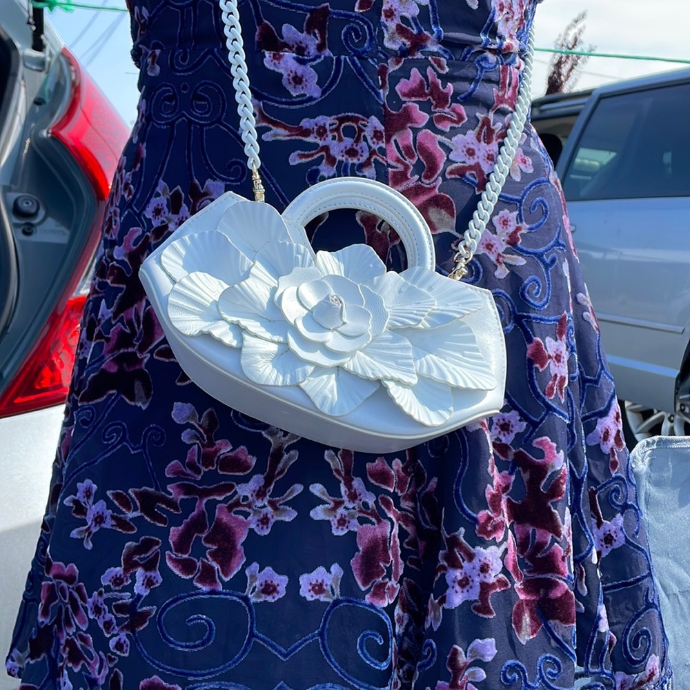 A beautiful one of kind white fancy handbag